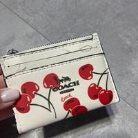 Portamonete e porta documenti coach