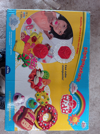 Giochi passeggino,casetta,chitarra,chocolateria