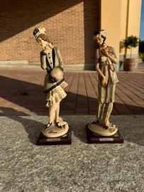 Due statuine G. Armani