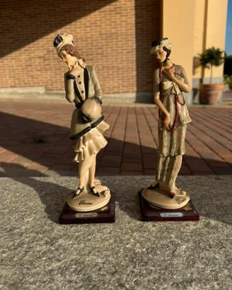 Due statuine G. Armani