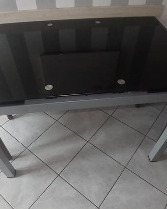tavolo in acciaio con piano in vetro