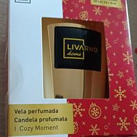 Candela aromatica in bicchiere di vetro con decoro