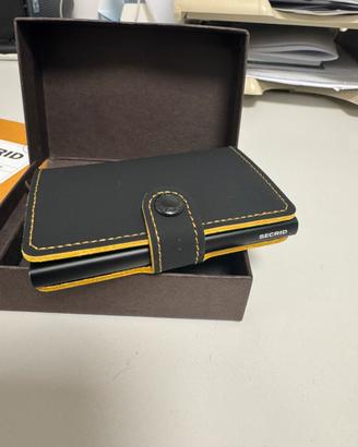 Secrid matte nero/ocra