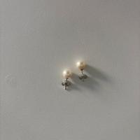 Orecchini di perle bianche e oro bianco