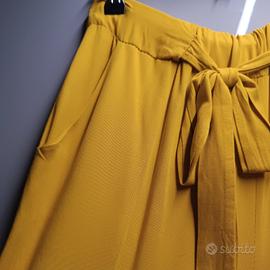 pantaloni sopra la caviglia