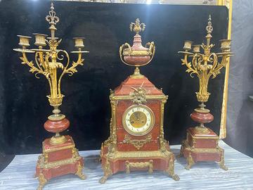 Trittico orologio e candelabri