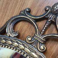 SPECCHIO OVALE IN OTTONE ANTICO