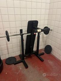 Panca multifunzione con bilanciere e pesi