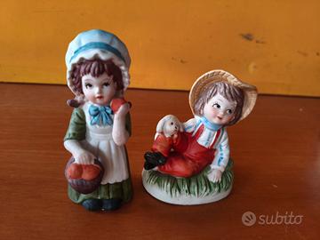 Coppia di statuette vintage in porcella biscuit