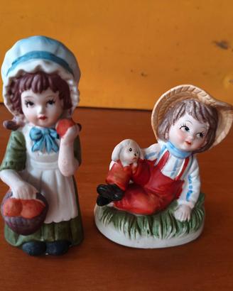 Coppia di statuette vintage in porcella biscuit