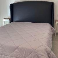 Letto matrimoniale con testiera alta