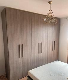 Camera, armadio, comò e comodini