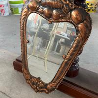 specchio vintage con cornice in rame 