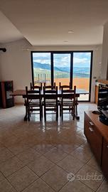 Attico arredato con vista mare, camino e ascensore