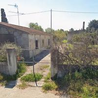 Terreno con fabbricati