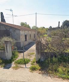 Terreno con fabbricati