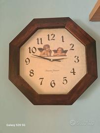 Orologio con  cornice il legno