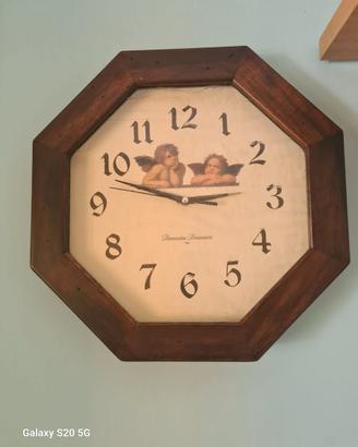 Orologio con  cornice il legno