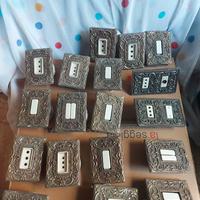 Placche e interruttori vintage in ottone e ceramic