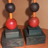 sculture legno/ferma libri