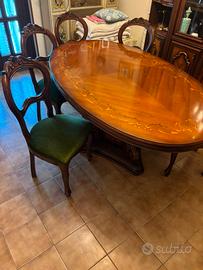 sala da pranzo con tavolo e 6 sedue