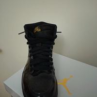 Air Jordan 1 Retro High nere oro metallizzate