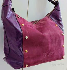 Borsa da donna vera pelle colore viola firmata.