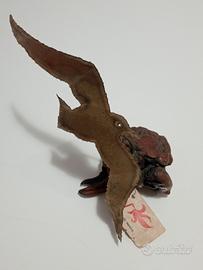 scultura artigianale in metallo e radica. 