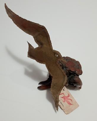 scultura artigianale in metallo e radica. 
