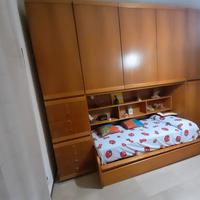 Cameretta con armadio a ponte e letti