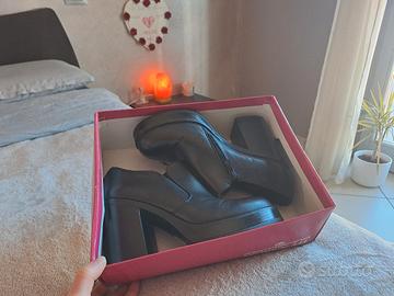 Tronchetti con plateau/stivaletti in pelle