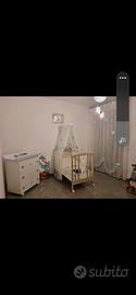 allestimento xuna cameretta da neonato com  foto
