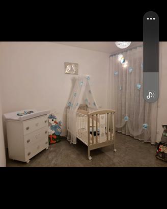 allestimento xuna cameretta da neonato com  foto