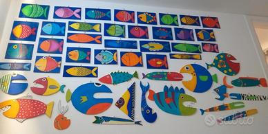 Pesci di legno ritagliati e dipinti a mano