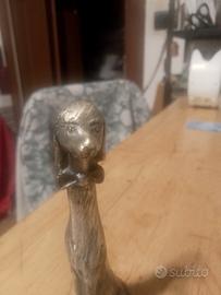 piccola scultura in peltro argentato 999