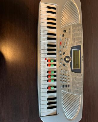 Pianola ettronica, con caricatore e custodia.