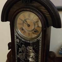 Orologio murale in legno d'epoca