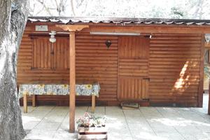 Roulotte Stanziale con Casetta in Legno e Veranda