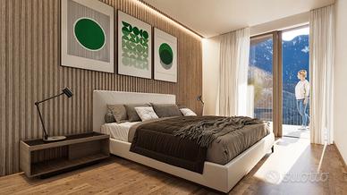 W9: Bilocale con terrazza e mansarda a Montagna