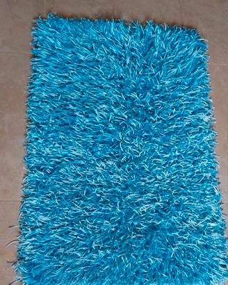Tappeto a frange lunghe color azzurro effetto luci