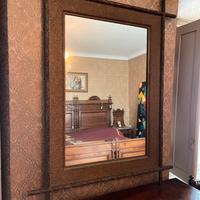 Specchi antico con cornice in bronzo