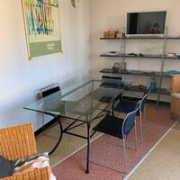 Tavolo in cristallo e ferro battuto + sedie design