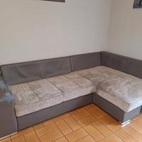 divano letto con penisola e contenitore 