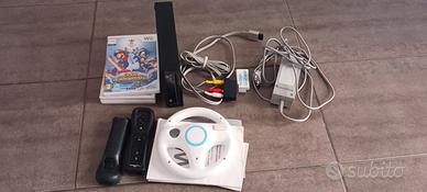 wii +balance board  nera boxata+4 giochi