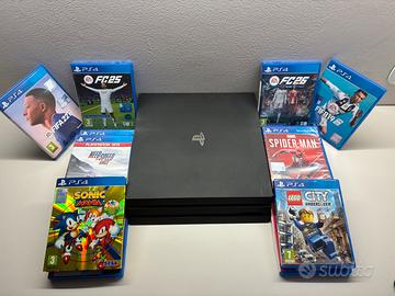 PS4 pro 3 piani + 14 giochi+ 2 joypad