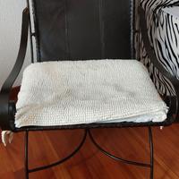 Poltrona design in ferro battuto e seduta in pelle