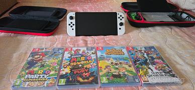 nintendo switch oled + 4 giochi + accessori 