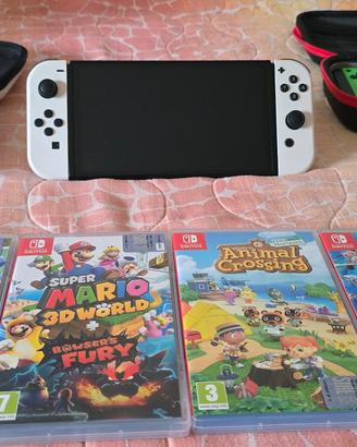 nintendo switch oled + 4 giochi + accessori 