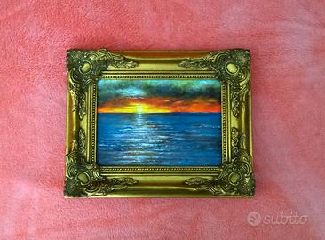 Quadro con cornice dorata in legno 