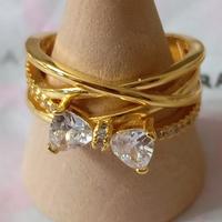 Anello Pandora fascia intrecciata fiocco oro